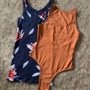 2 brand new XS tops.